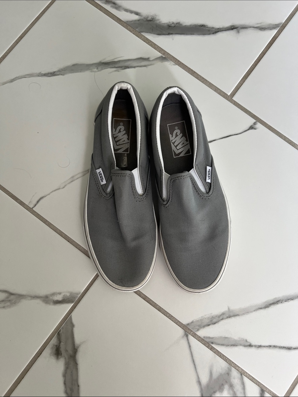 Vans Slip-On Canvas Sneakers in Gray with White Trim